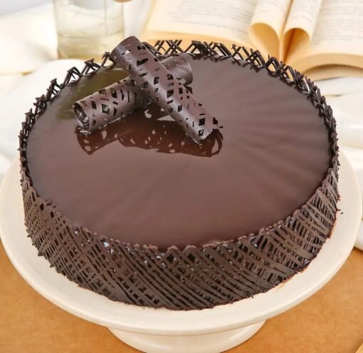 Decadent Chocolate Truffle Cake topped with smooth truffle cream and rich chocolate layers