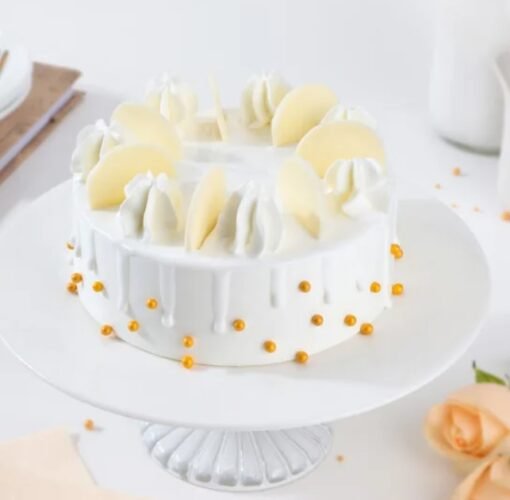 Close-up of Cloudy White Cream Cake showcasing airy texture and creamy frosting