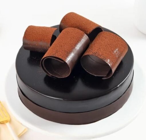 Chocolate Temptations Cake with a smooth, rich chocolate topping, perfect for weddings and special events