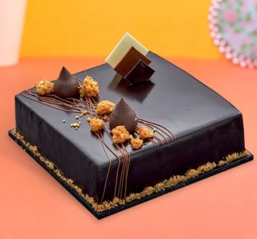 Luxurious Belgium Chocolate Truffle Cake topped with velvety chocolate ganache