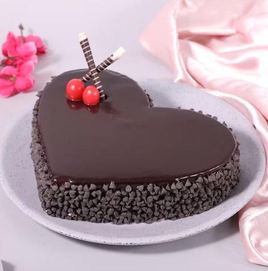 Screenshot 2024-12-05 153506 Exquisite Heart Shape Truffle Cake with rich chocolate layers and smooth truffle filling