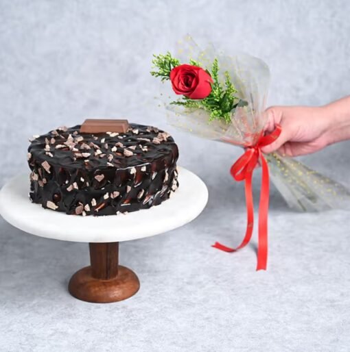 A regal bouquet of fresh roses paired with a delicious cake, the perfect indulgence for any occasion.